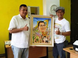 Yang Muda ke Parlemen, KFA Terima Karikatur dari Kartunis Edi Darma